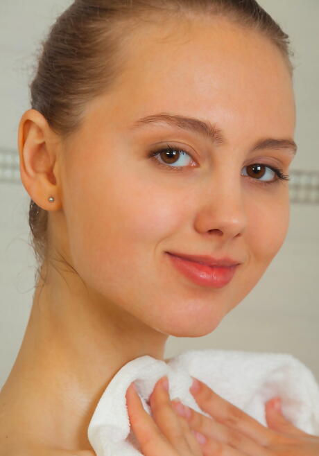 Very attractive young Nalina baring her ass and spreading her legs in shower